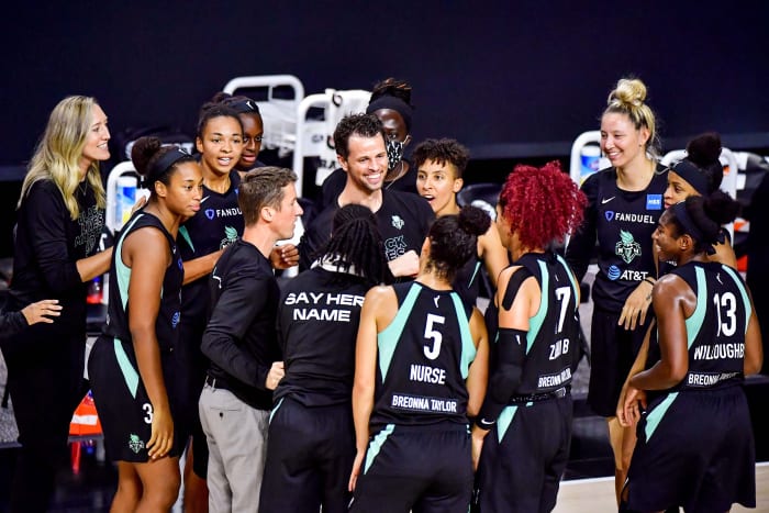 The 2020 Liberty teams crowds around Walt Hopkins